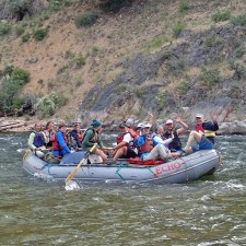 An oar boat full of happy campers