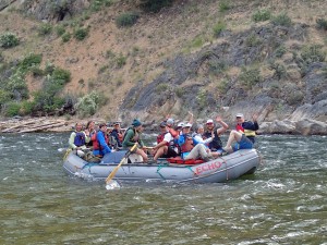 An oar boat full of happy campers