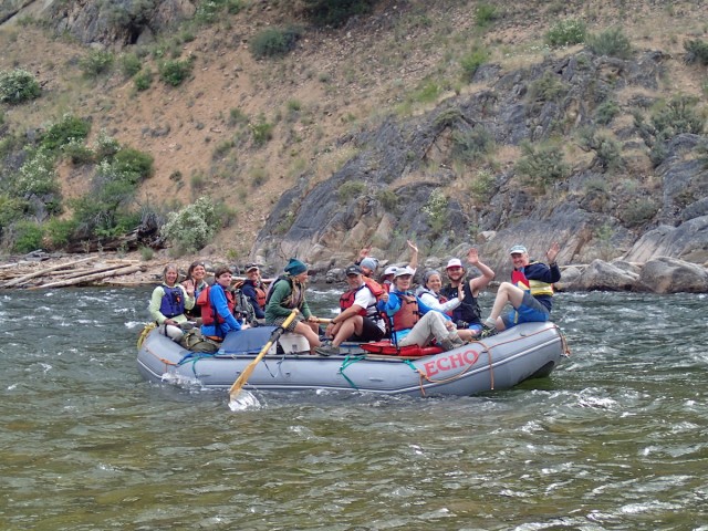 An oar boat full of happy campers